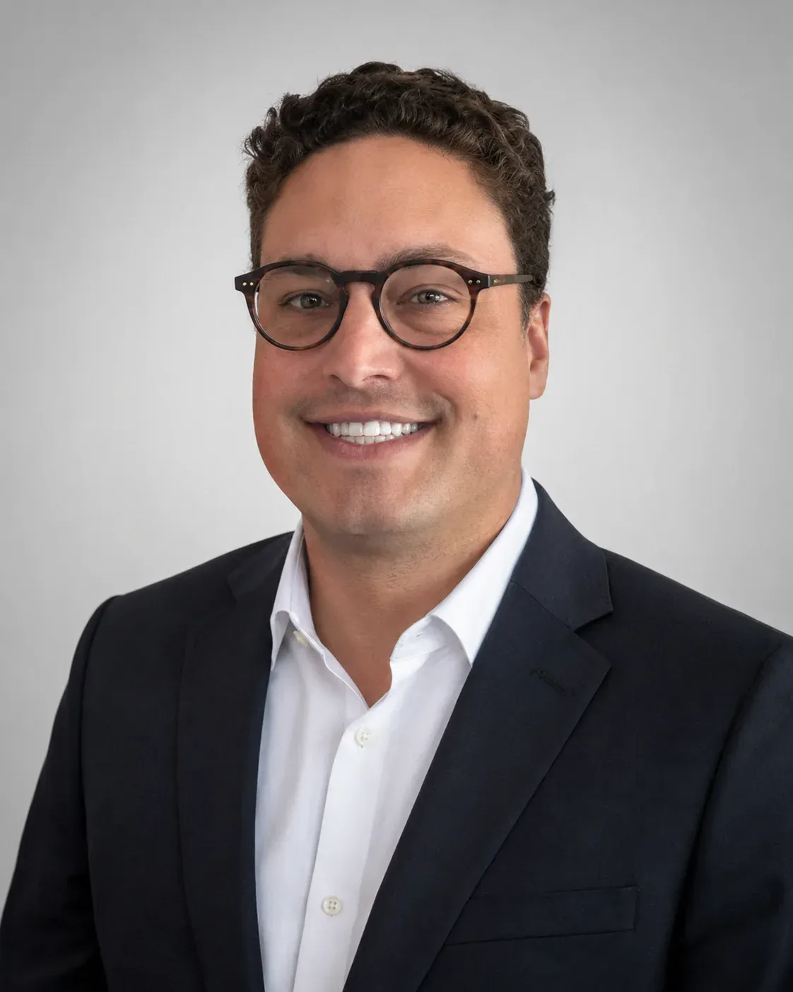 Ashton Zenuk in a professional leadership portrait.