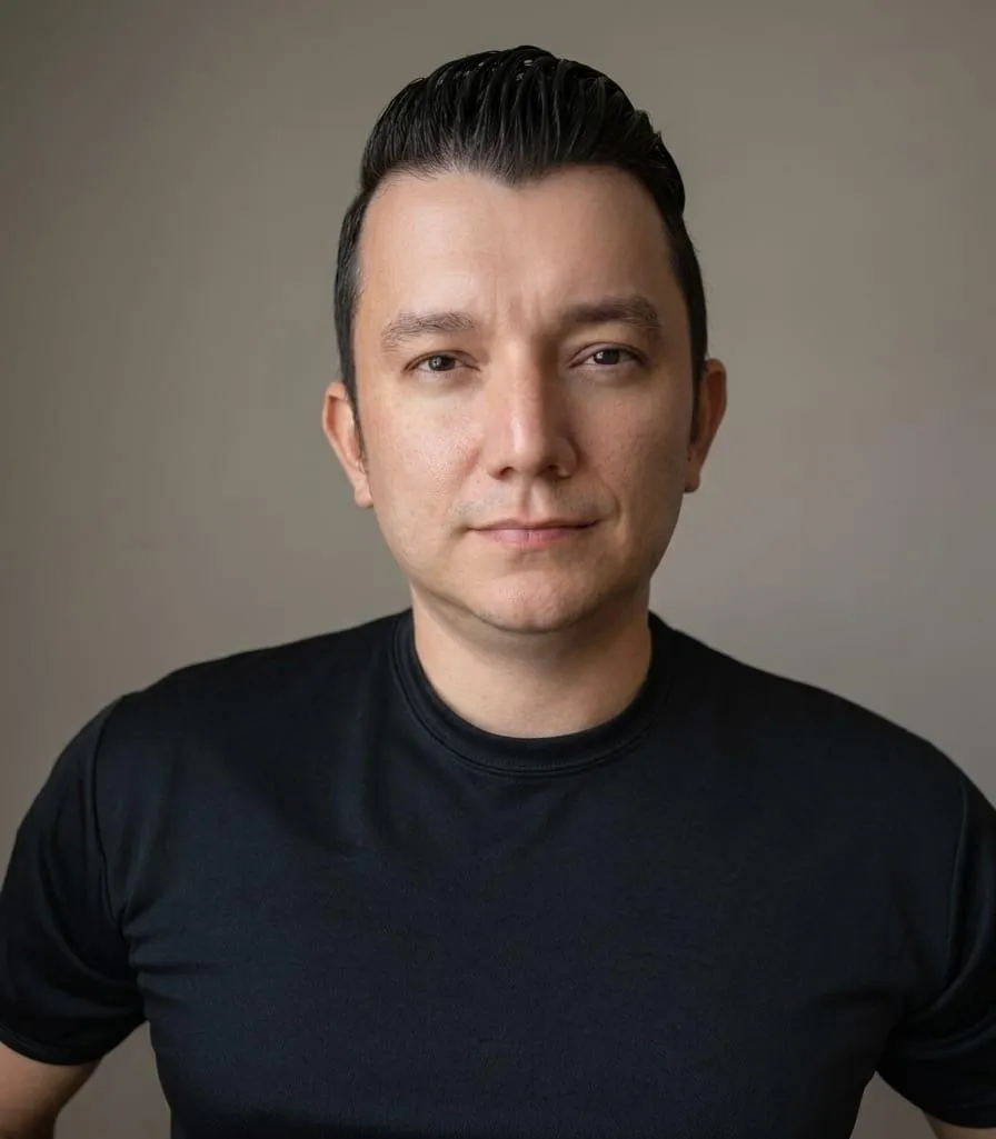 Hector Acosta in a professional engineering portrait.