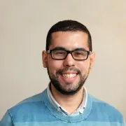Raymond Batista smiling for a therapist review.